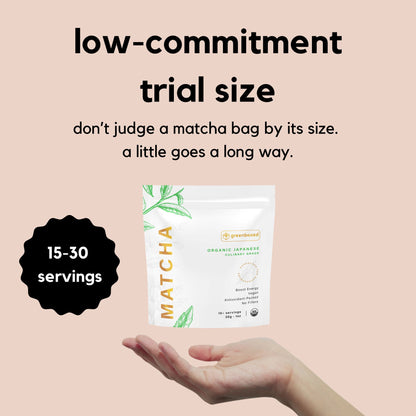 Hand with greenboxed matcha pouch 1oz - 30g displaying the size of the bag. There is a text that states " low - commitment trial size , don't judge a matcha bag by its size. A little goes a long way" . 15 to 30  servings per 1oz - 30g bag.  White pouch